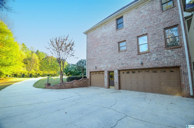 view of property exterior with a garage