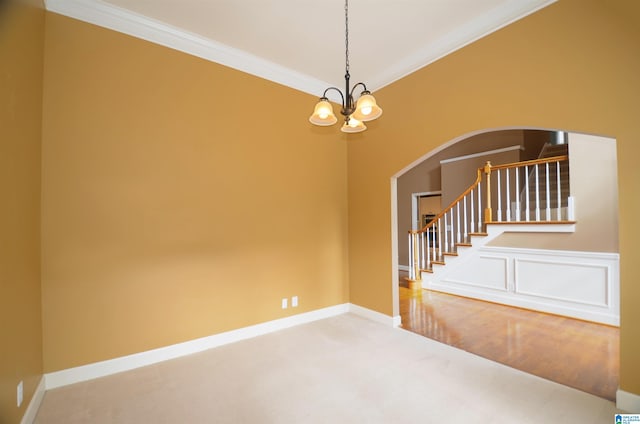 interior space with hardwood / wood-style floors, an inviting chandelier, and ornamental molding