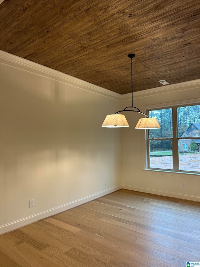 spare room with light hardwood / wood-style flooring, crown molding, and wood ceiling