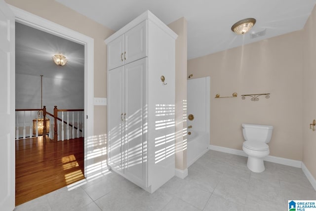 bathroom featuring toilet, independent shower and bath, and hardwood / wood-style flooring