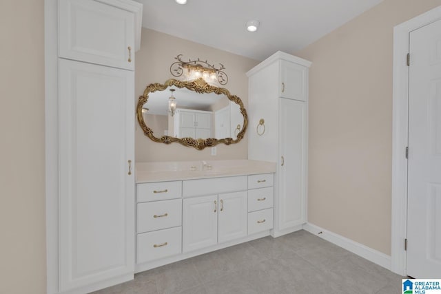 bathroom featuring tile patterned floors and vanity