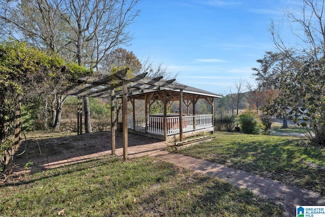 view of yard with a pergola and a wooden deck