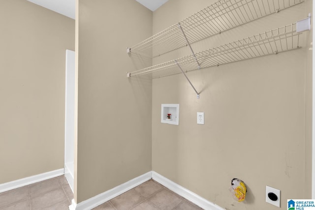 laundry room with tile patterned flooring, washer hookup, and electric dryer hookup