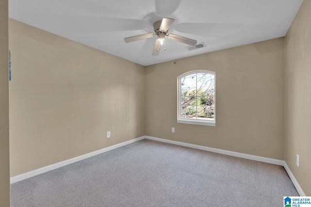 carpeted empty room with ceiling fan