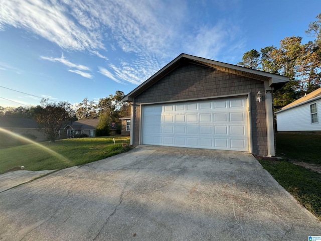 garage featuring a yard