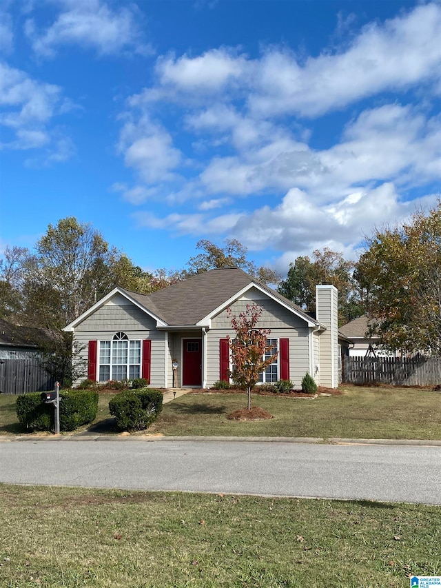 single story home with a front yard