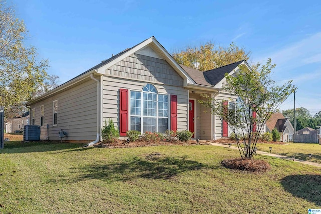 view of front of house featuring central AC and a front lawn