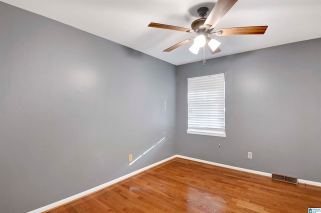 empty room with wood-type flooring and ceiling fan