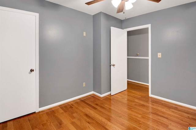 unfurnished bedroom with light wood-type flooring and ceiling fan