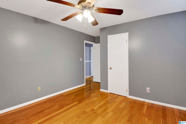 spare room featuring light wood-type flooring and ceiling fan