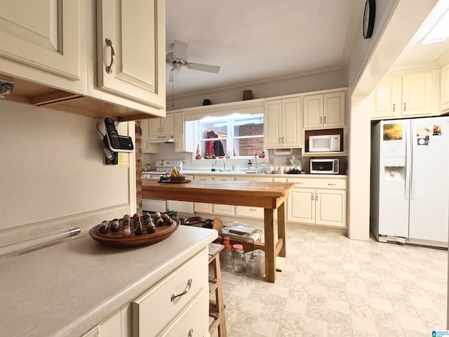 kitchen featuring ceiling fan, sink, white appliances, and ornamental molding