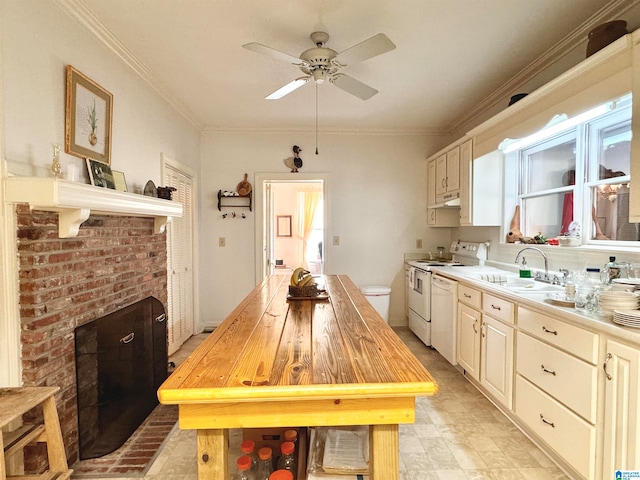 kitchen featuring butcher block counters, ceiling fan, sink, crown molding, and white appliances