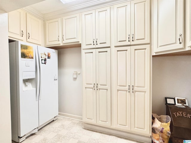 kitchen with white refrigerator with ice dispenser