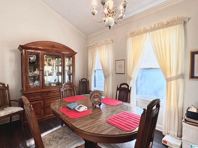 dining room featuring ornamental molding, dark hardwood / wood-style floors, and a notable chandelier