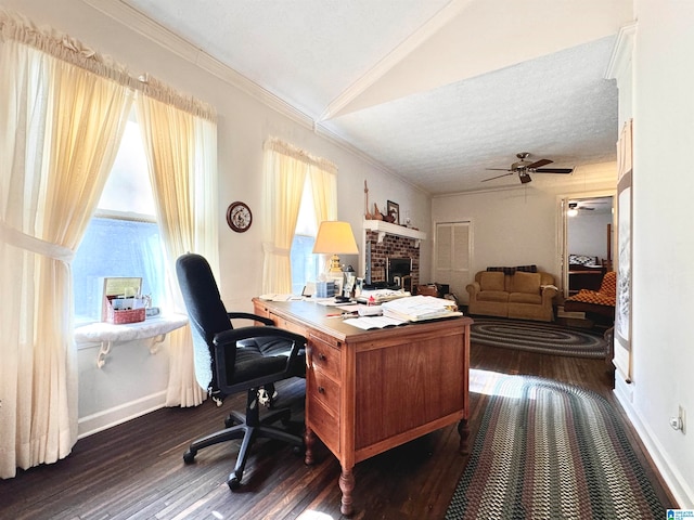 office space featuring dark wood-type flooring, crown molding, vaulted ceiling, ceiling fan, and a textured ceiling