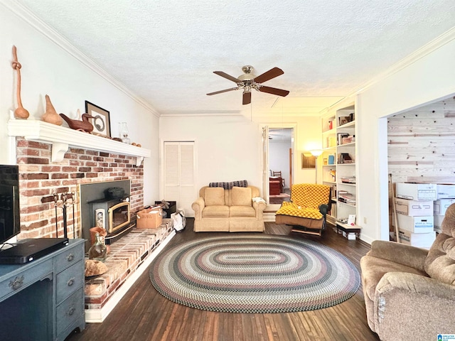 living room featuring a textured ceiling, dark hardwood / wood-style floors, and a wood stove