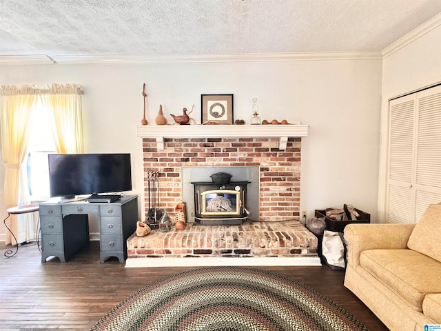 living room featuring a textured ceiling, crown molding, a wood stove, and dark wood-type flooring