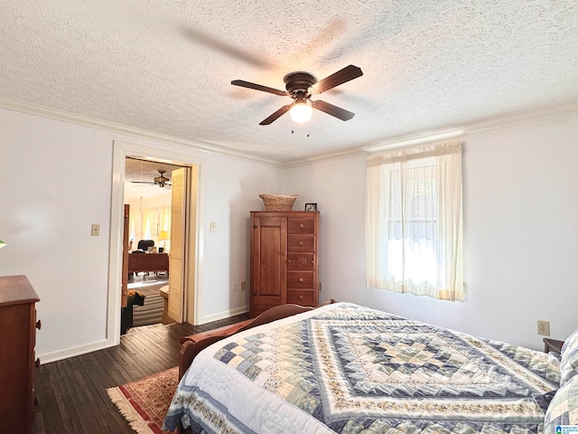 bedroom featuring a textured ceiling, ceiling fan, dark hardwood / wood-style floors, and ornamental molding