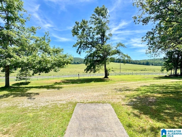 view of yard with a rural view