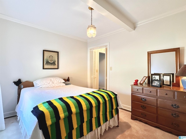 bedroom with beam ceiling, ornamental molding, light carpet, and a closet