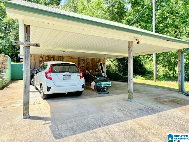 view of parking / parking lot featuring a carport