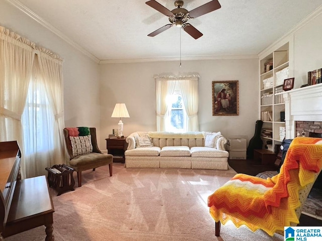 carpeted living room with ceiling fan, a textured ceiling, and ornamental molding