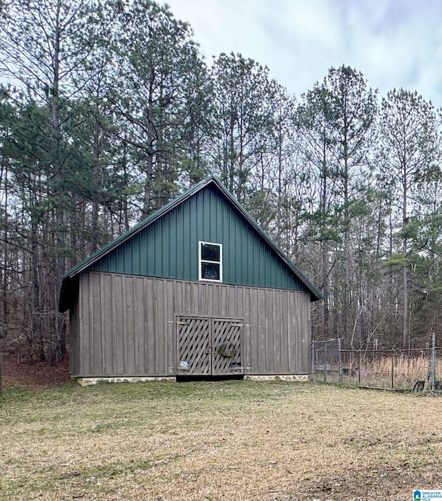 view of outbuilding featuring a yard