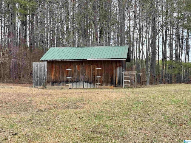 view of outdoor structure with a lawn