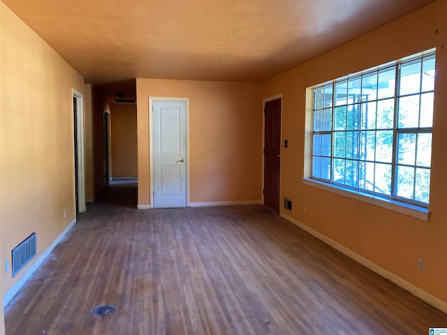 unfurnished bedroom featuring dark hardwood / wood-style floors