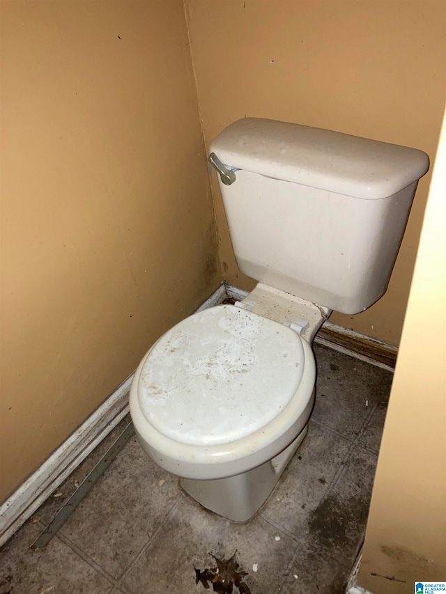 bathroom with tile patterned flooring and toilet