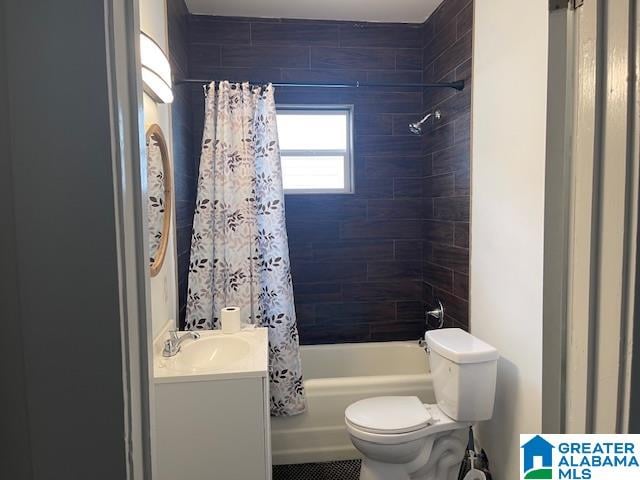 full bathroom featuring shower / bath combo, toilet, and vanity