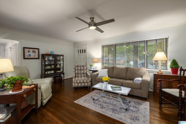 living room featuring crown molding, dark hardwood / wood-style flooring, and ceiling fan