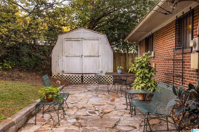 view of patio / terrace featuring a storage shed