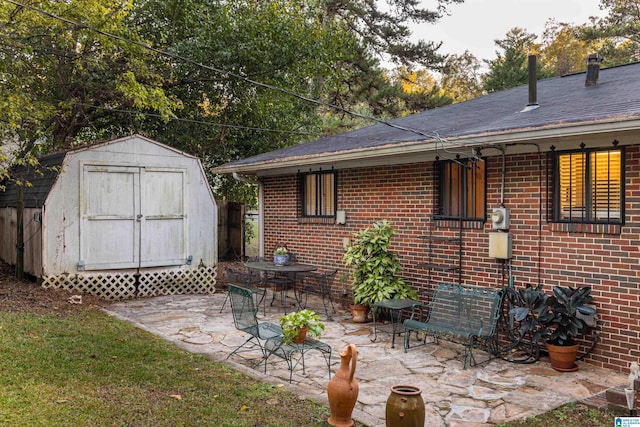 view of patio / terrace with a storage shed