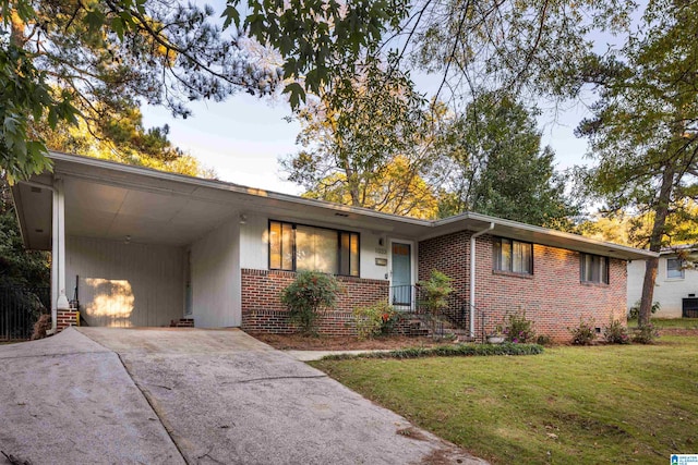 single story home with a carport and a front yard