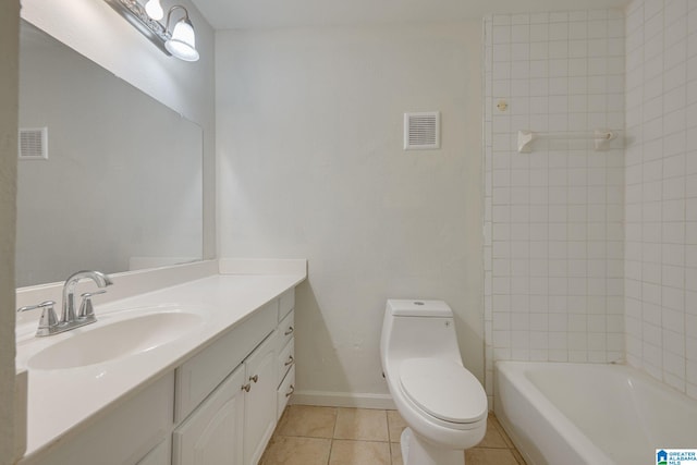 bathroom with tile patterned flooring, vanity, and toilet