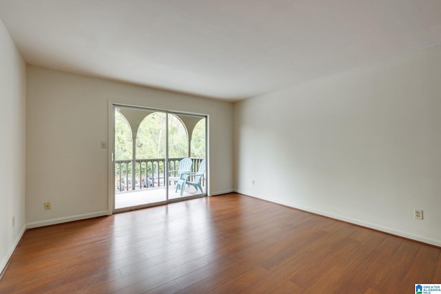 spare room with hardwood / wood-style floors