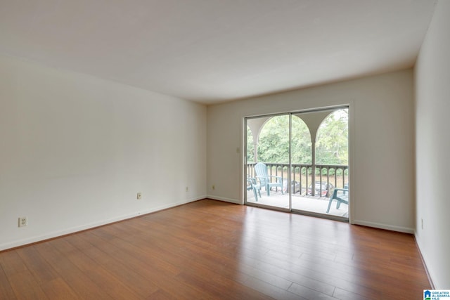 unfurnished room with light wood-type flooring