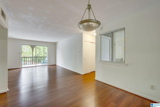 unfurnished room featuring hardwood / wood-style floors