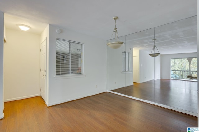 unfurnished room featuring hardwood / wood-style floors