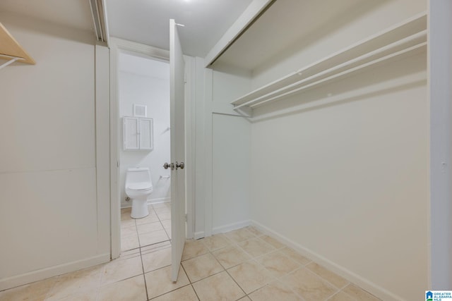 spacious closet with light tile patterned flooring