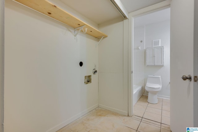 washroom featuring light tile patterned floors and hookup for a washing machine