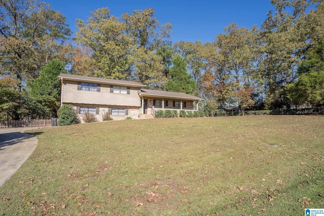 split level home featuring a front yard