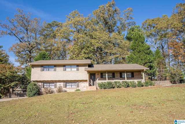 tri-level home featuring a front lawn