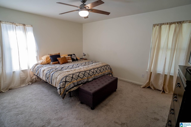 bedroom with ceiling fan and carpet floors