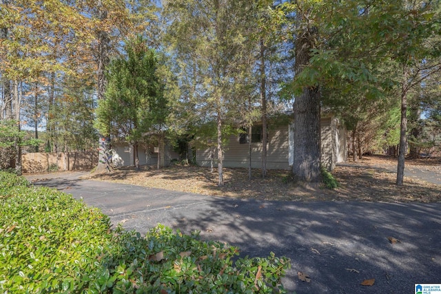 view of property hidden behind natural elements