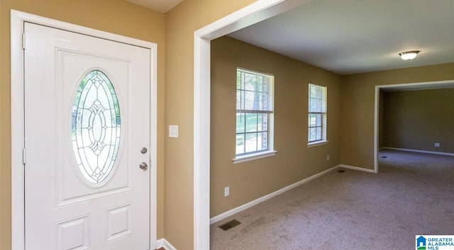 view of carpeted entrance foyer