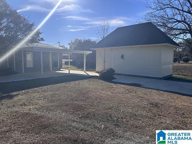 view of side of home featuring a patio area