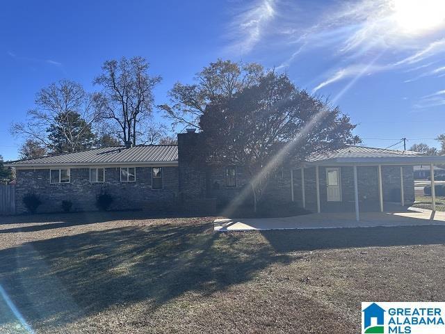 rear view of property featuring a patio area