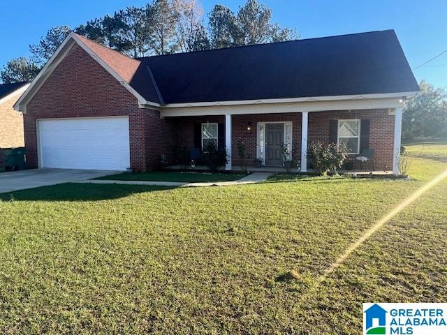 view of front of home with a front yard and a garage